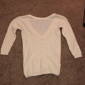 Small white sweater open back.